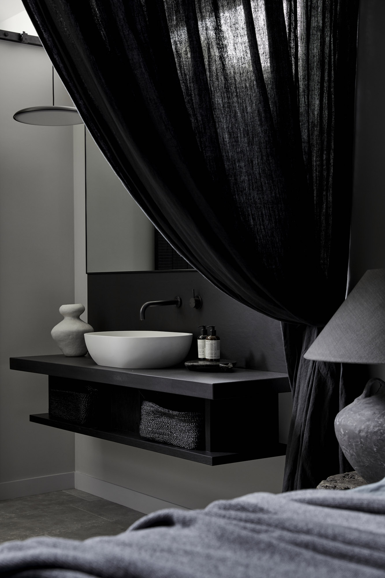 Curved white stone bath in the Bower Studios at The Bower Byron Bay hotel