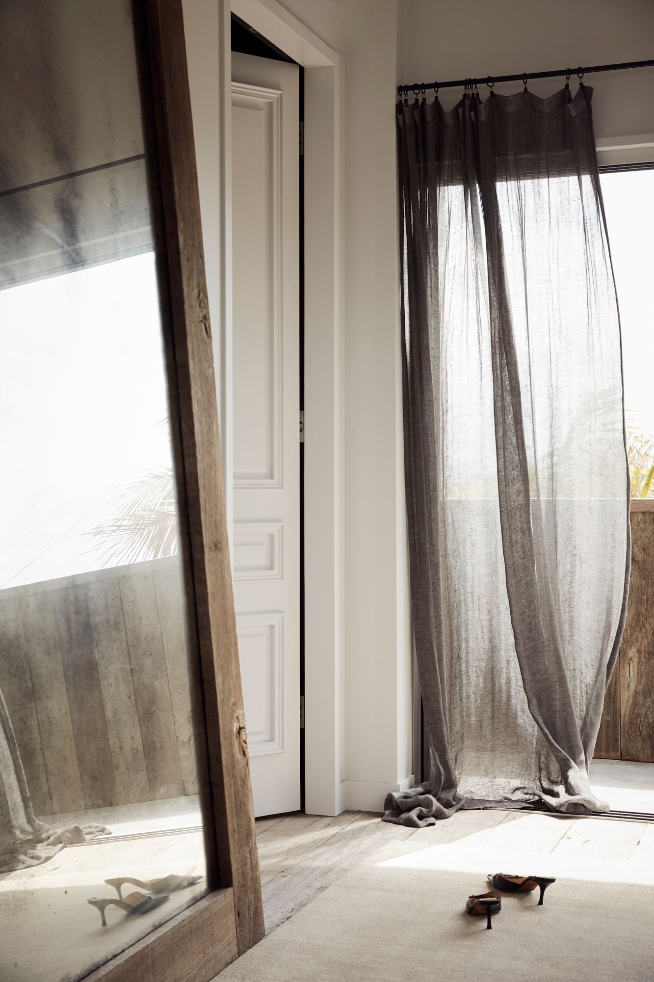 Tall wall mirror with timber frame at The Lodge, Byron Beach Abodes
