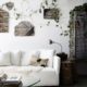 Vintage wall mirrors, trailling greenery, white linen sofa and logs used as side tables at The Chapel, Byron Beach Abodes