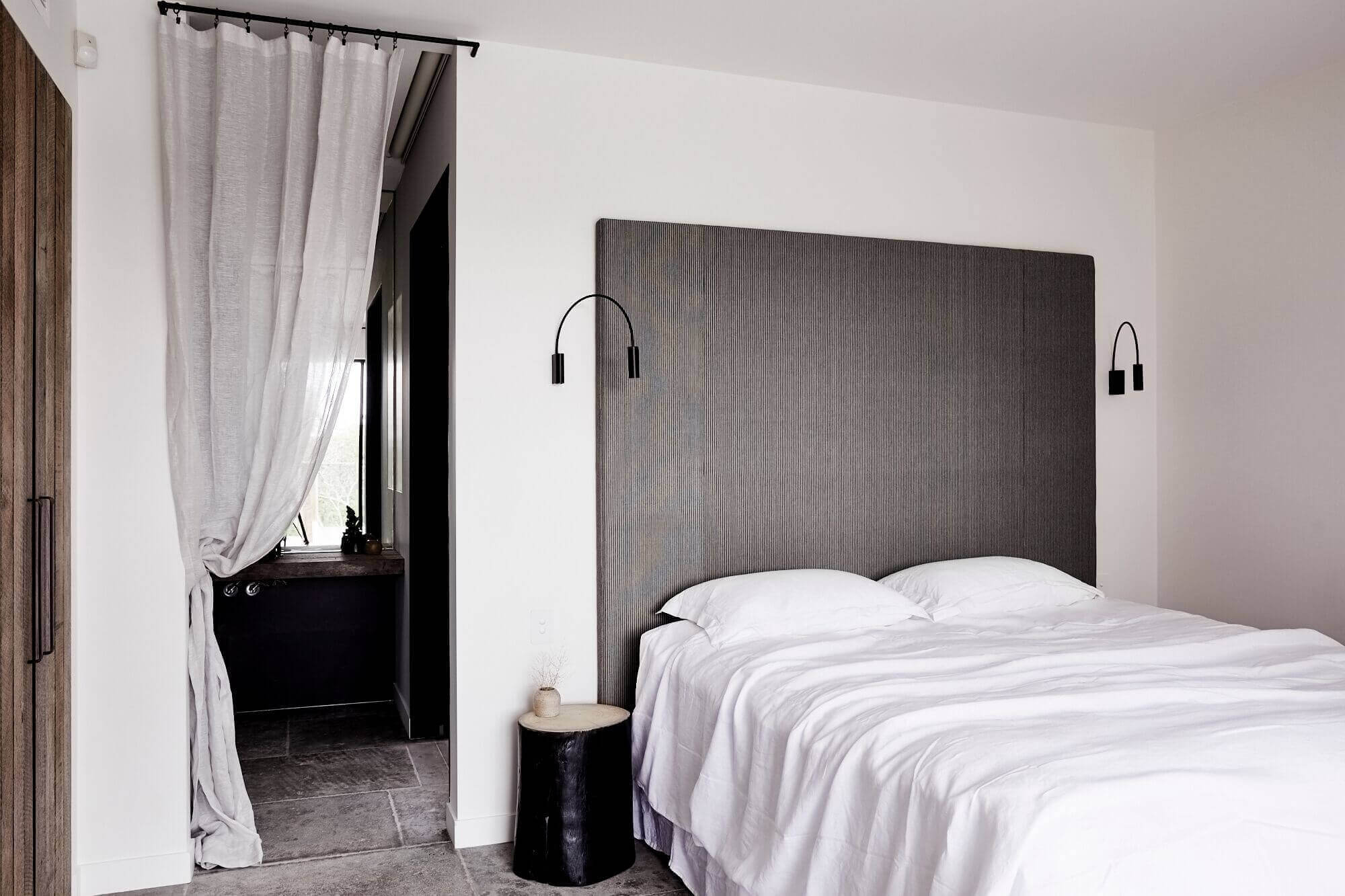 Luxury bedroom at The Cabin, Byron Beach Abodes with bespoke Ralph Lauren fabric bedhead