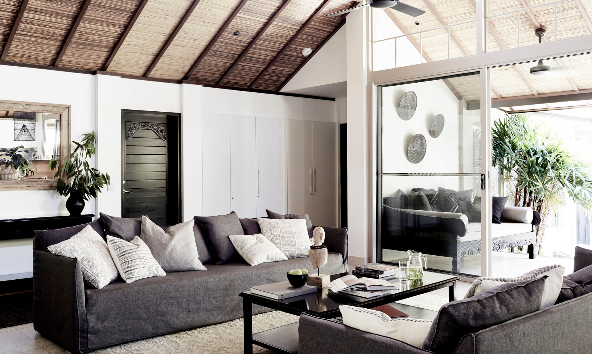 Open plan lounge room with high vaulted ceiling at The Villas of Byron