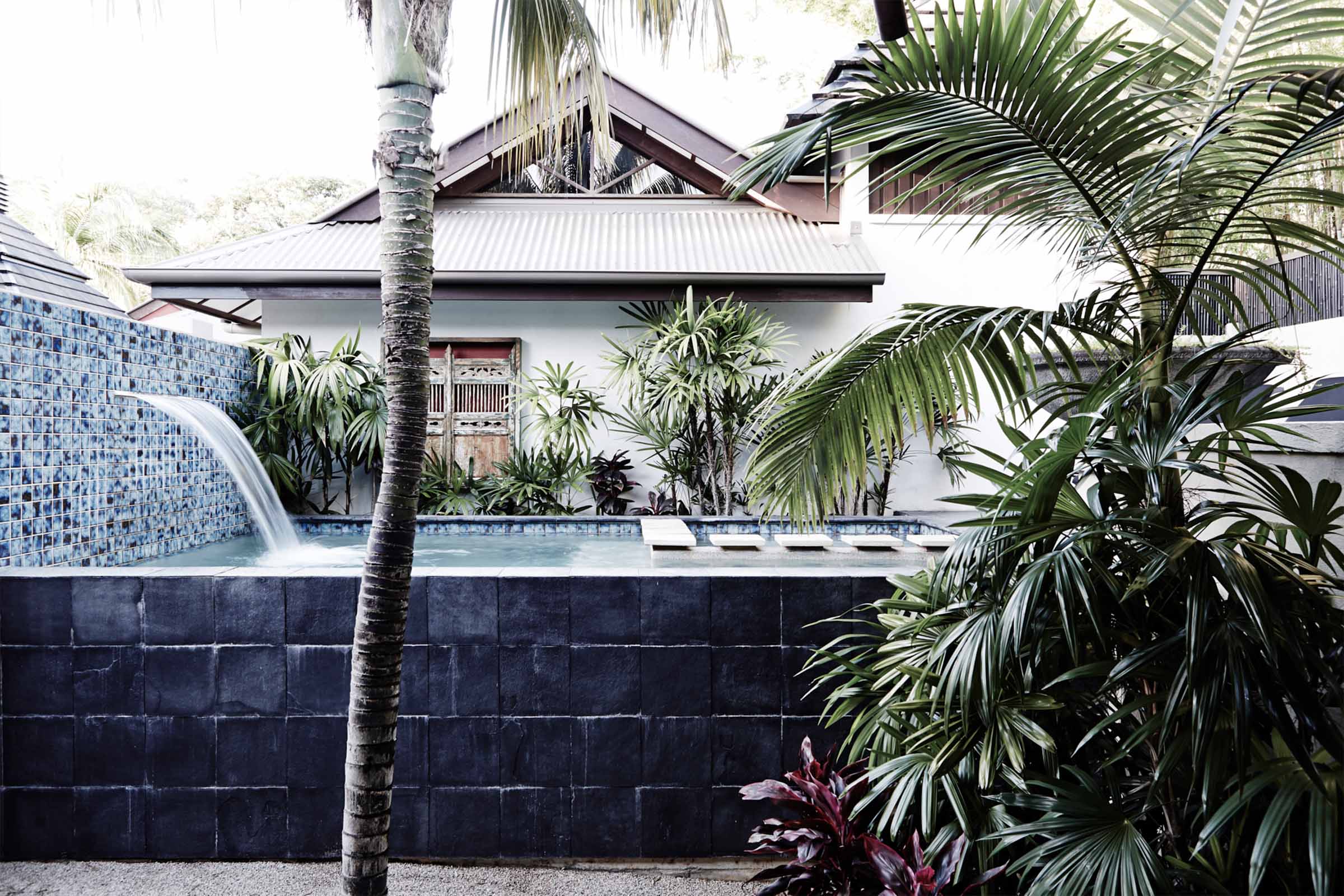 Luxury private pool, heated spa, waterfall and tropical gardens at the Standard Villa, Villas of Byron