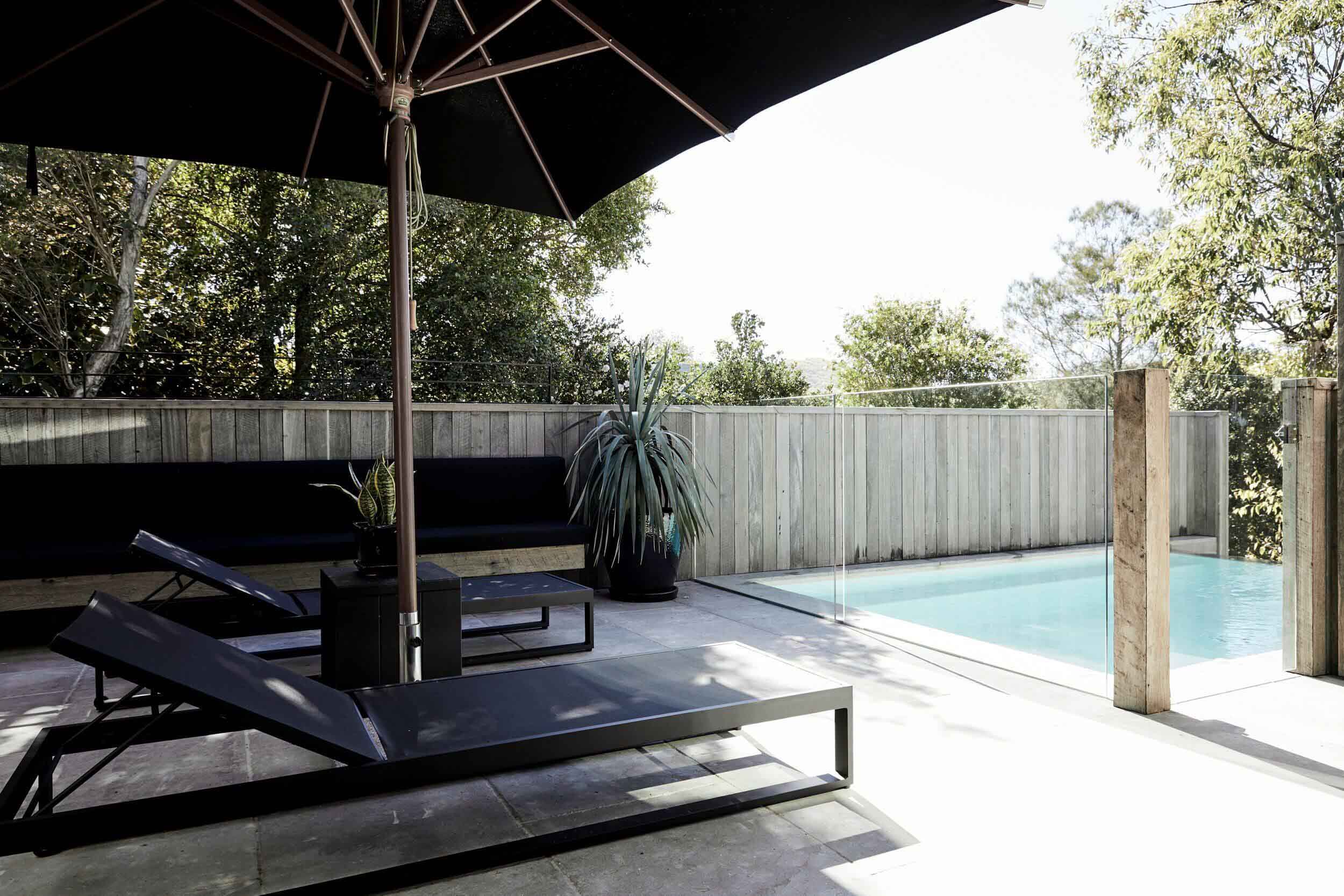 Daybeds beside the pool at The Cabin, Byron Beach Abodes