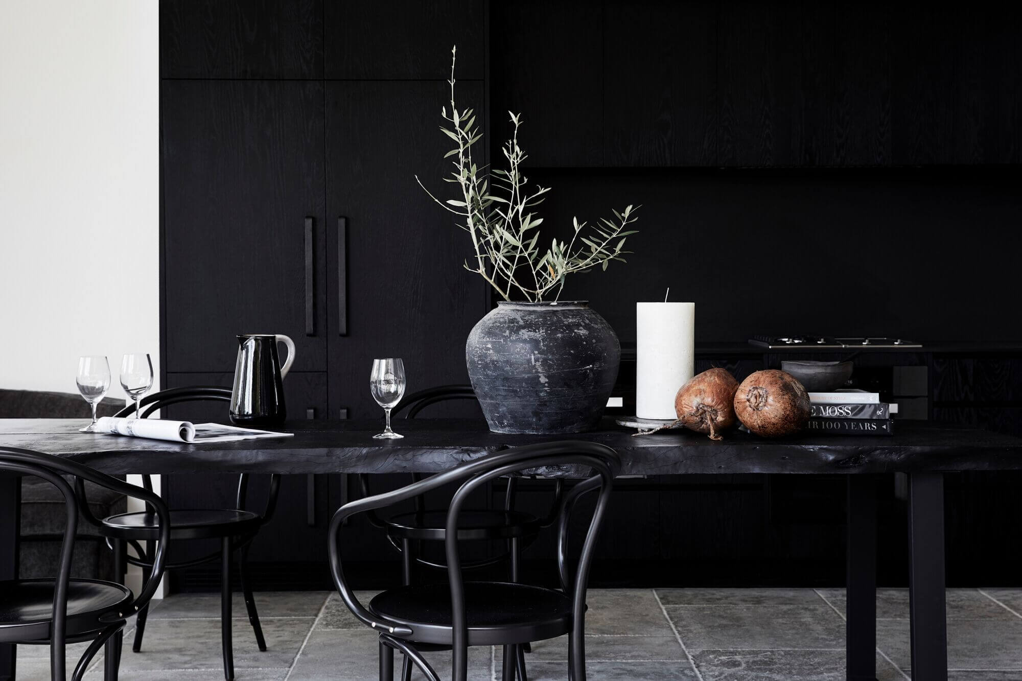 Custom black Oak kitchen cabinetry and live-edge timber dining table at The Cabin, Byron Beach Abodes