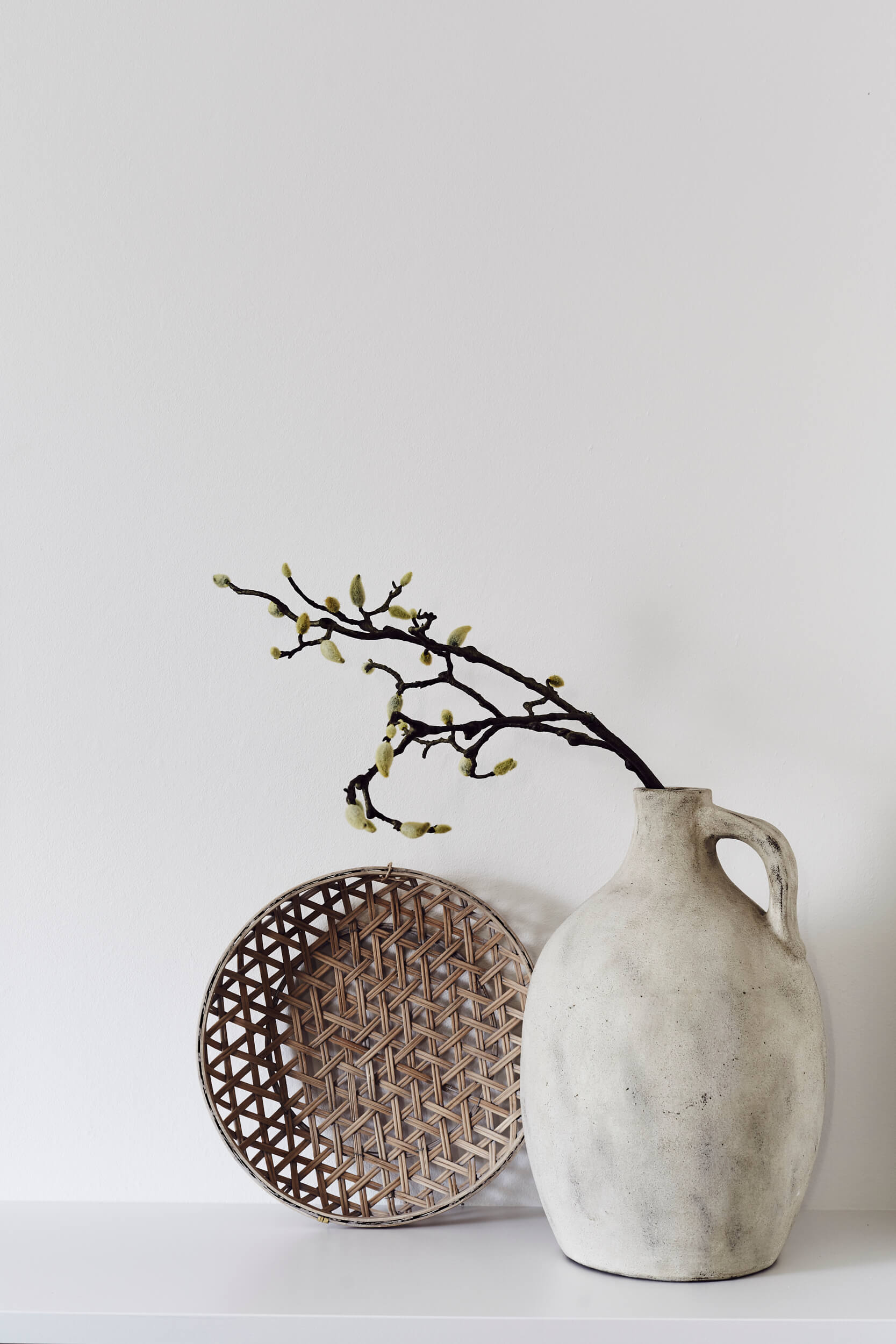 Handmade ceramic vase and woven basket at The Bower Byron Bay