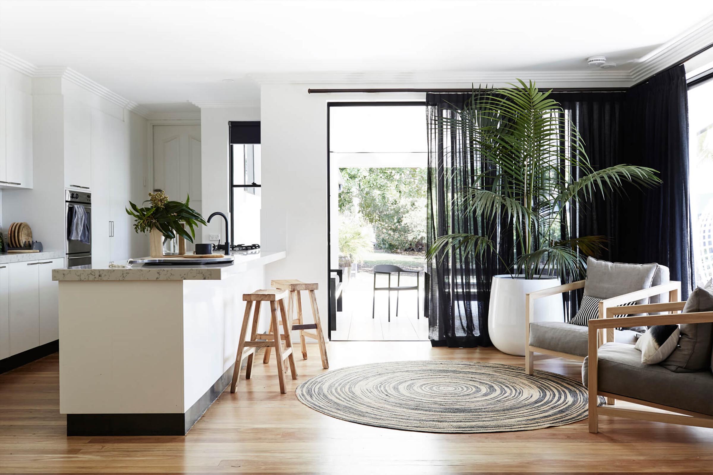 Open plan kitchen sitting area leading out to the private courtyard at Bower House, The Bower Byron Bay
