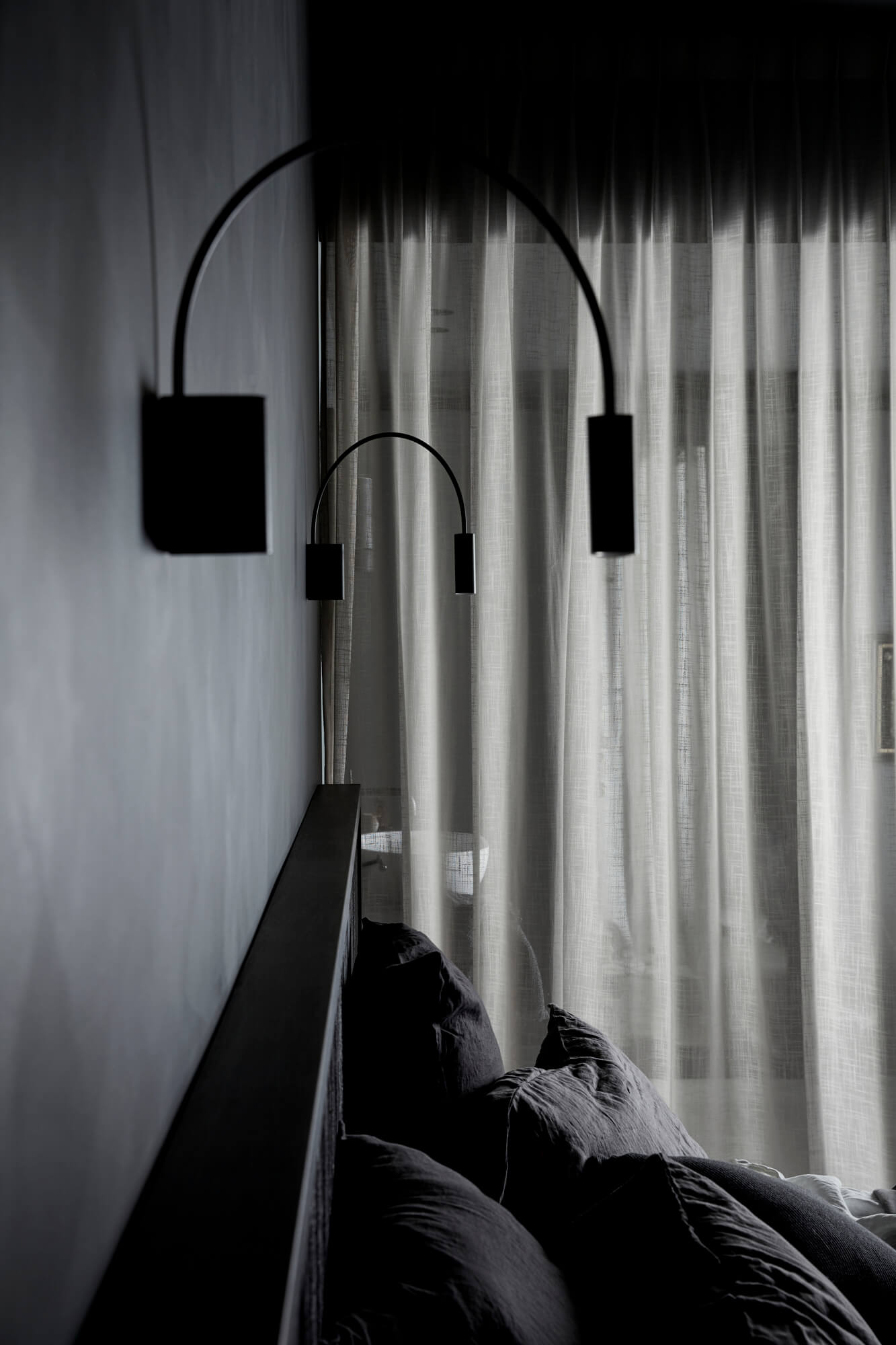 Statement black metal wall light at Deluxe King Room at The Bower Byron Bay hotel