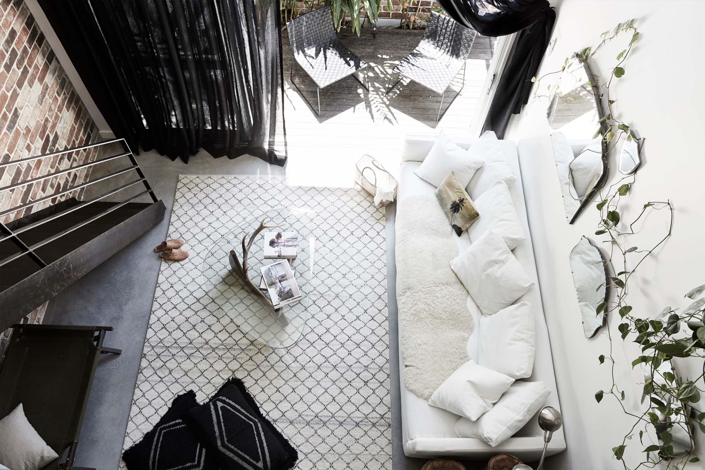 Overhead view of The Chapel's lounge room and courtyard. A Byron Beach Abodes property.