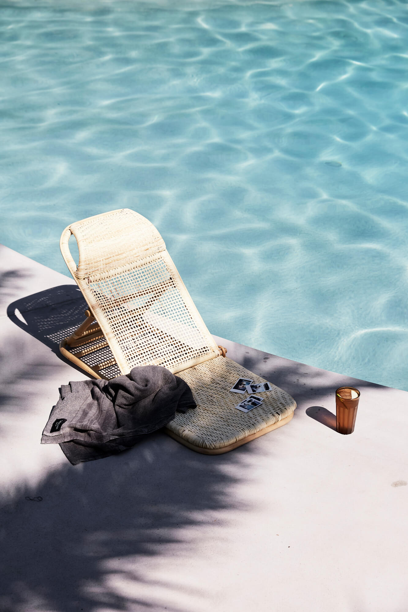 Rattan pool chair beside the pool at The Bower Byron Bay