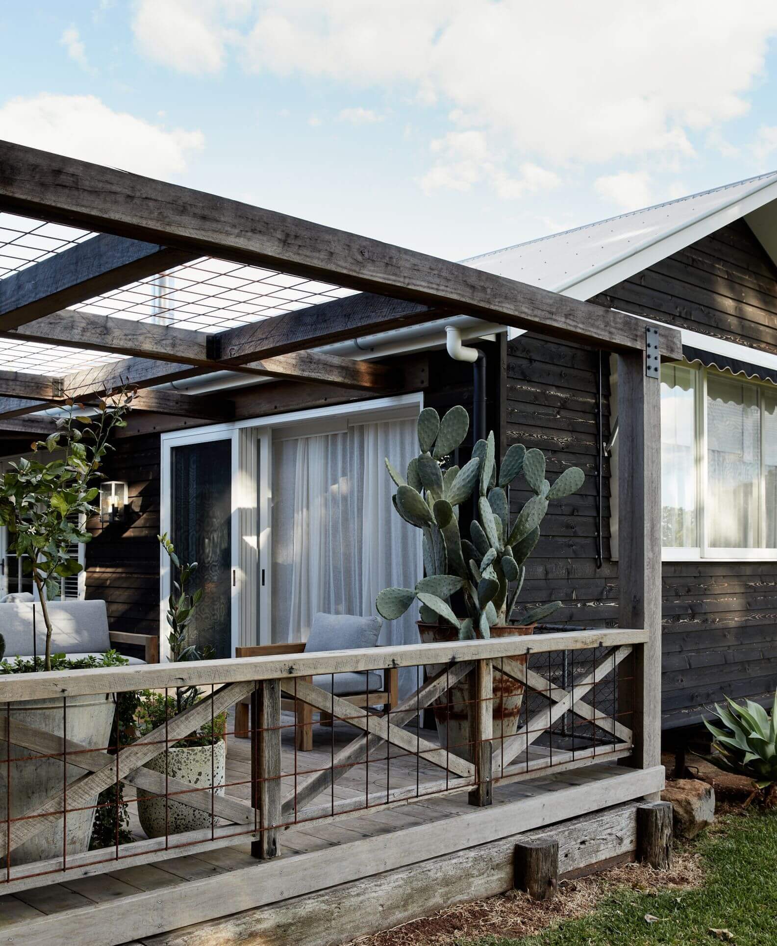 Exterior cladding and outdoor seating area, Le Viti Barn