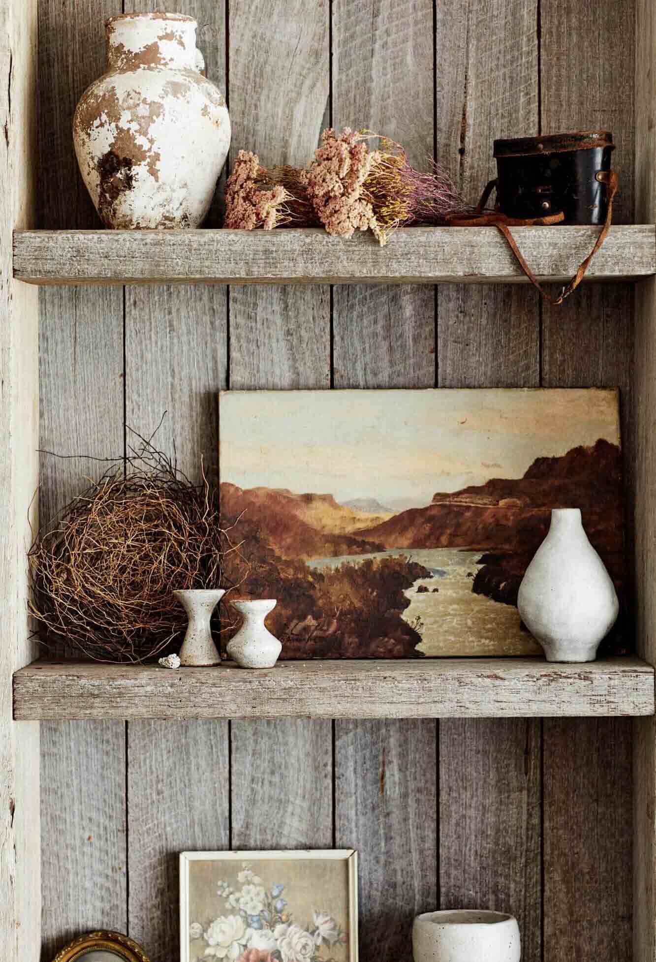 Custom timber shelving with collection of ceramics and vintage art at The Lodge, Byron Beach Abodes